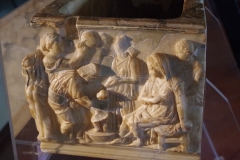 Detail from the right side of the child sarcophagus, depicting the birth of the child.