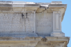 Detail of the inscription to Trajan's sister on the Arch of Trajan.
