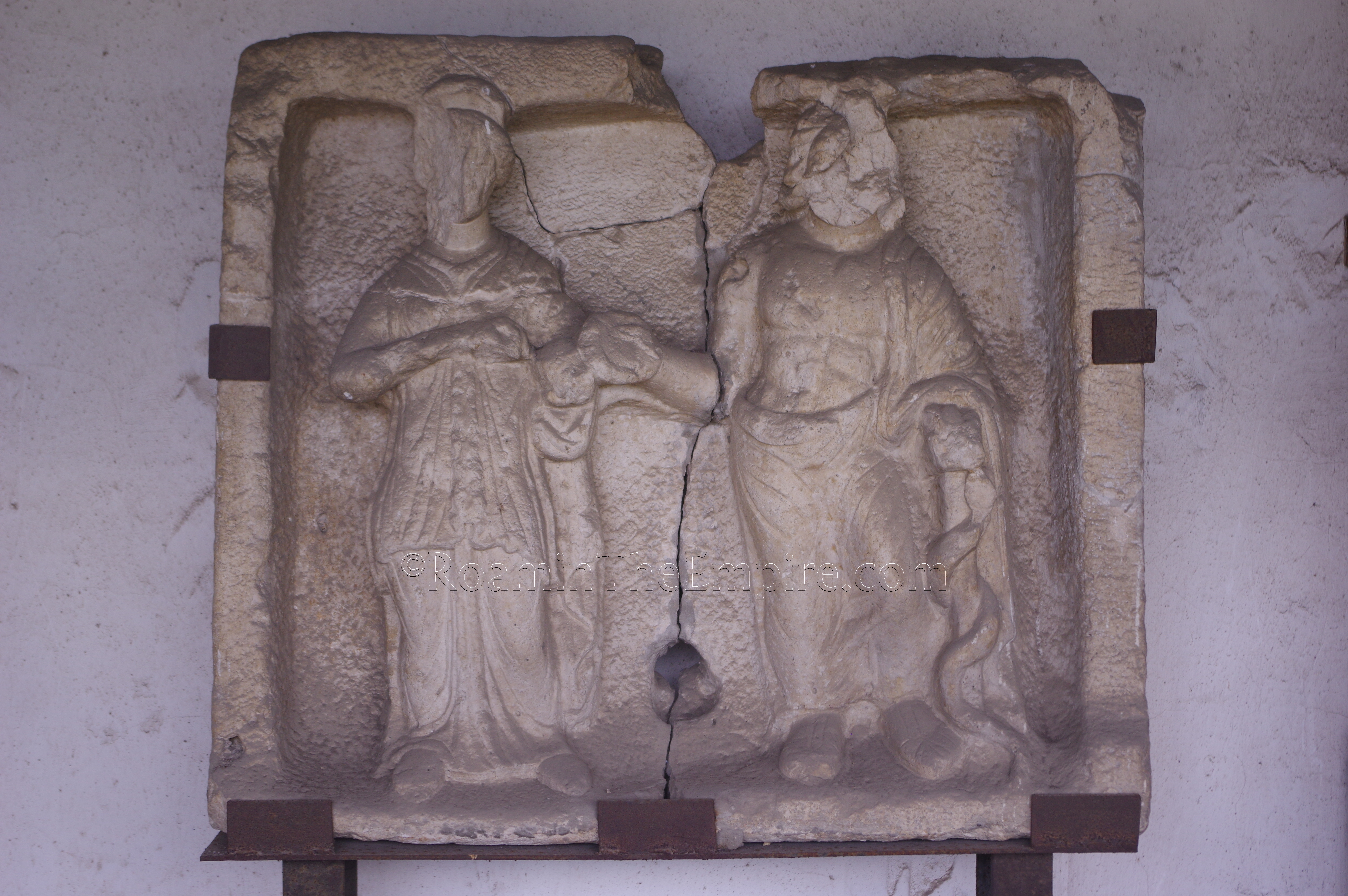 Relief depicting Aclepius and Hygeia from the lapidarium on the east side of Aquincum.