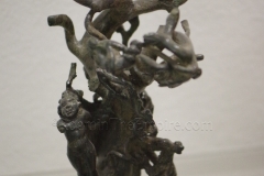 Bronze decorative element with erotes around a tree. Dated to the 3rd century CE. Aquincum Archaeological Museum.