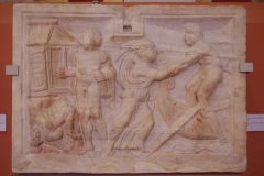 Side panel of a sarcophagus depicting Iphegenia fleeing from Tauris. Found in Pécs-Aranyhegy. Dated to the middle of the 2nd century CE. Magyar Nemzeti Múzeum.