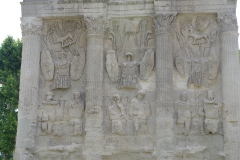 Detail of the east face of the triumphal arch depicting trophies and prisoners.