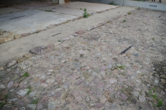 Road and crepido adjacent to the U House.