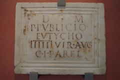 Funerary inscription for Publius Publicius Eutyches from Alyscamps which mentions Colonia Julia Paterna Arelate. In the Musée de l'Arles et de la Provence Antique.