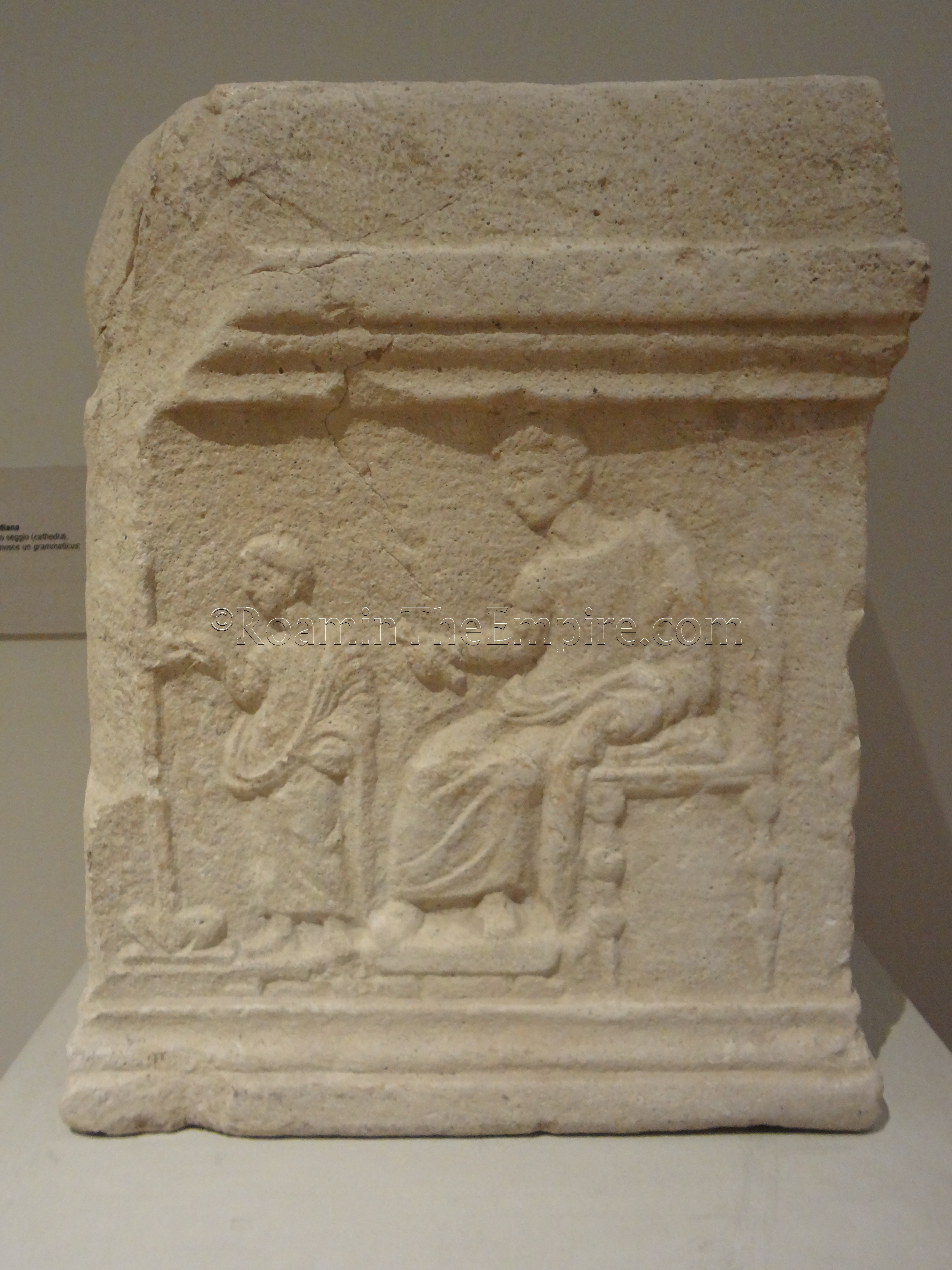 Relief of a school scene with a grammaticus watching over a child. In the Museo della Città, dated to the 1st century CE.