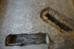 Medeival graves cut into the mosaics at the Domus del Chirurgo.