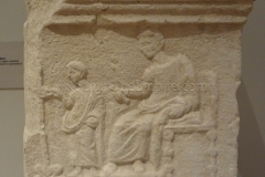Relief of a school scene with a grammaticus watching over a child. In the Museo della Città, dated to the 1st century CE.