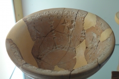 Mould of a bowl with images of offerings, Maenads, and dancers.