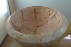Mould of a bowl with images of musicians.