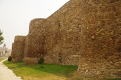 Medieval walls built on the Roman circuit.
