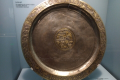Platter from the silver hoard discovered near the castrum depicting a central scene of a villa by the sea and hunting scenes around the edges. Museum and Römerhaus Augusta Raurica.
