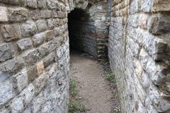 Water channel leading through basilica/forum retaining walls.