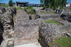 Area of tabernae at the south end of the basilica, cut by the 3rd century CE fortification wall.