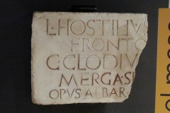 Inscription of Lucius Hostilius Fronto and Gaius Clodius Merga noting their contribution of the opus albariorum decoration of the Republican sanctuary.