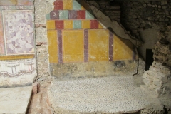 Exposed area of alternate fresco and mosaic in the Republican temple.