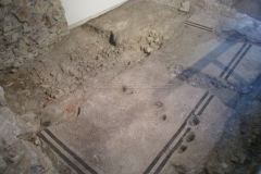 Mosaic floor of the Santa Giulia Domus with post holes. Museo di Santa Giulia.