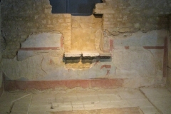 Niche and painted wall from the Courtyard of the Pygmies in the Domus of Dionysus. Museo di Santa Giulia.