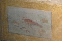 Wall painting in the triclinium of the Domus of Dionysus. Museo di Santa Giulia.