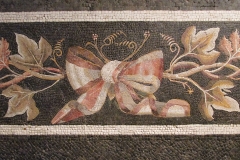 Detail of a bow, vine, and ivy mosaic from Aquileia. Dated to the mid-1st century BCE.  Museo di Santa Giulia.