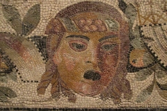 Detail of a plant and mask mosaic from Imola. Dated to the 1st century BCE. Museo di Santa Giulia.