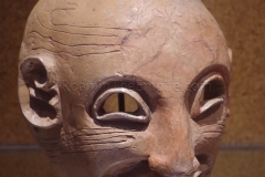 Terracotta apotropaic mask from the Punic necropolis at Tharros. Displayed in the Museo Archeologico Nazionale di Cagliari.