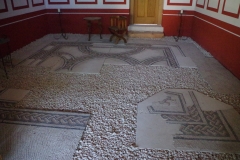 In situ mosaic flooring in the triclinium of the Domus Quarta.
