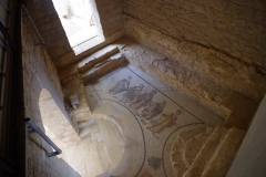 Mosaic from the private entry to the bathing complex depicting the domina of the villa receiving guests.