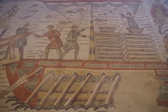 Detail of the Great Hunt mosaic with a scene of animals and goods being loaded onto a boat.