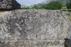 Detail of the ΔΙΟΣ ΣΩΤΗΡΟΣ inscription on the north altar in the agora.