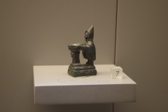 Bronze figure of Telesphorus making a sacrifice at an altar.  Found in Astorga. Museo de León.