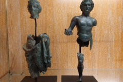 Bronze sculpture fragments depicting a pair of deities, possibly the Gallic goddess Rosmerta. and Mercury. Dated to the end of the 2nd or beginning of the 3rd century CE. From Forêt d'Othe. Musée Archéologique de Dijon.