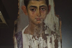 Mummy portrait depicting a young boy. Dated to around 115 CE. From Antinoupolis. Musée des Beaux-Arts de Dijon.