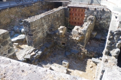 Building adjacent to the road in the courtyard of the Monastero dei Benedettini di San Nicolò L'Arena.