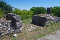 Base of the arch of the aqueduct remains over the Hellenistic path.