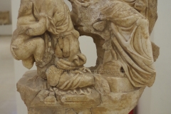Trapezophoros depicting a nurse shielding a child from Medea. Dated to the 2nd century CE. Archaeological Museum of Dion.