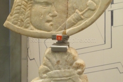 Marble oscilla fragments, one with the image of a theater mask and gladium. Dated tot he 1st century CE.