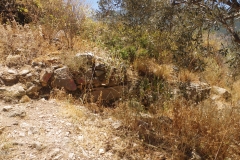 Remains along path up to acropolis.