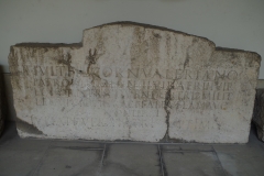 Funerary inscription of Titus Julius Valerianus, originally from Colonia Julia Equestris, but re-used in the fortifications of Genava. Valerianus was a duumvir and tribune of Legio VI Victrix. Musée d'Art et d'Histoire.