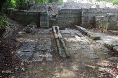 Water channels leading from the frigidarium, in the service area of the public baths.