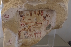 Painted funerary aedicula with a funerary banquet scene and Punic symbols. Dated to the 1st century BCE.