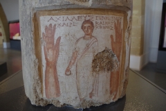 Painted and Greek inscribed funerary column of Achilleus, son of Prothymos, possibly killed in a criminal manner due to the raised hand motiff. Dated to the late 3rd century BCE.