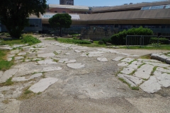 Road through the Hellenistic gates in the Jardin des Vestiges.