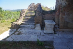 Stairway and statue pedestal of Gnaeus Paperius Christos at the odeon.