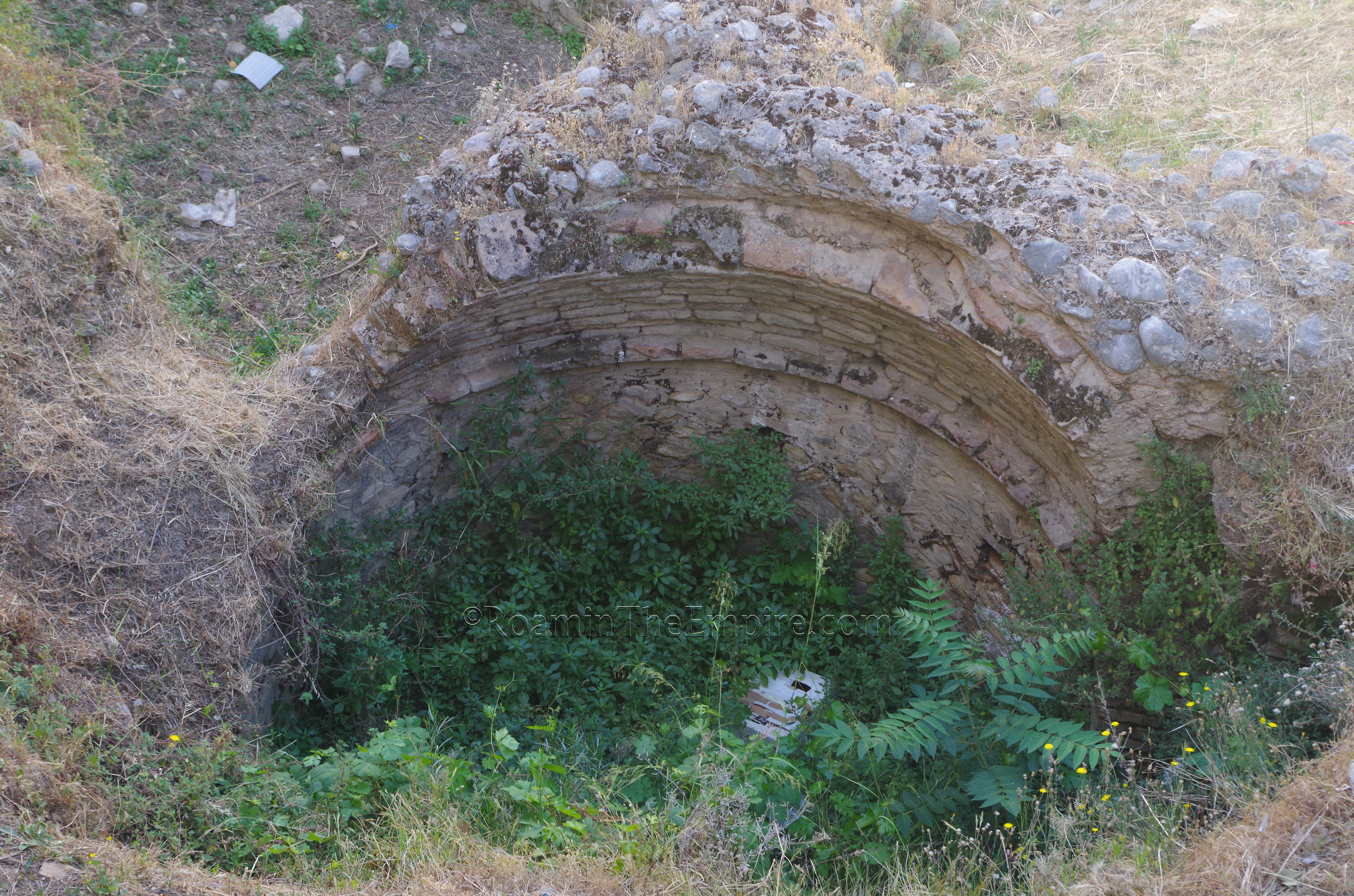 Detail of the well-like structure in the excavated area adjacent the odeon.