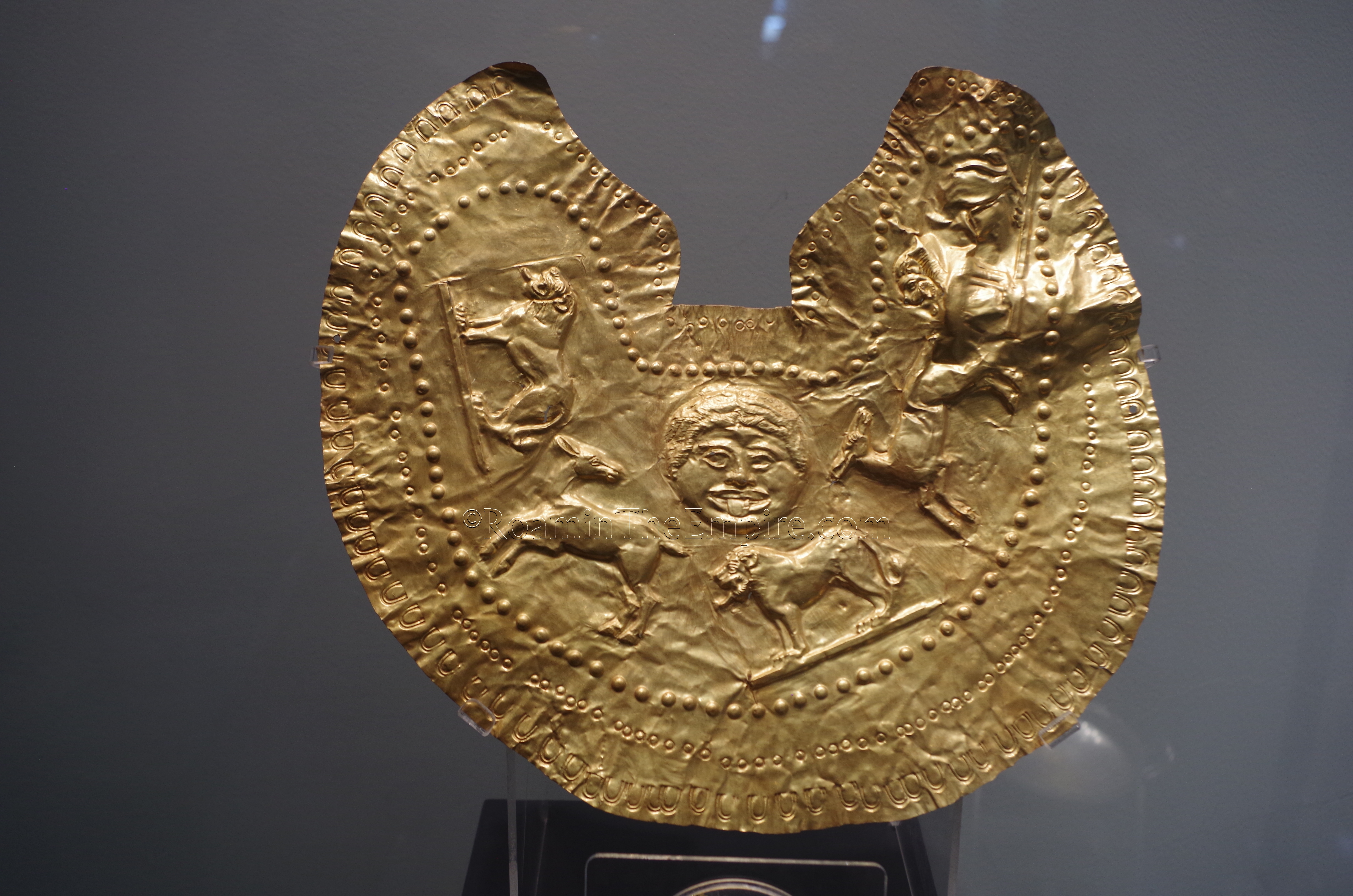 Gold pectoral piece depicting lions, deer, and Medusa from a 5th century BCE Thracian tomb at Chernozem. Regional Archaeological Museum.