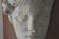 Head of a female statue, possibly Isis. Dated to the Antonine period.. From Sarsina. Museo Nazionale Archaeologico.