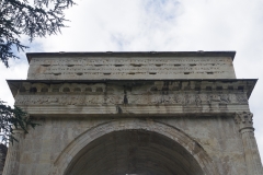 Detail of the north inscription and frieze of the Arch of Augustus.