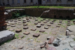 Room with remains of a hypocaust system (possibly caldarium) in the Church of St. George Rotunda baths.