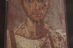 Encaustic painted portrait of a man on a wood panel. Possibly from Antinoe, dated to the mid-2nd century CE. Museo Egizio.