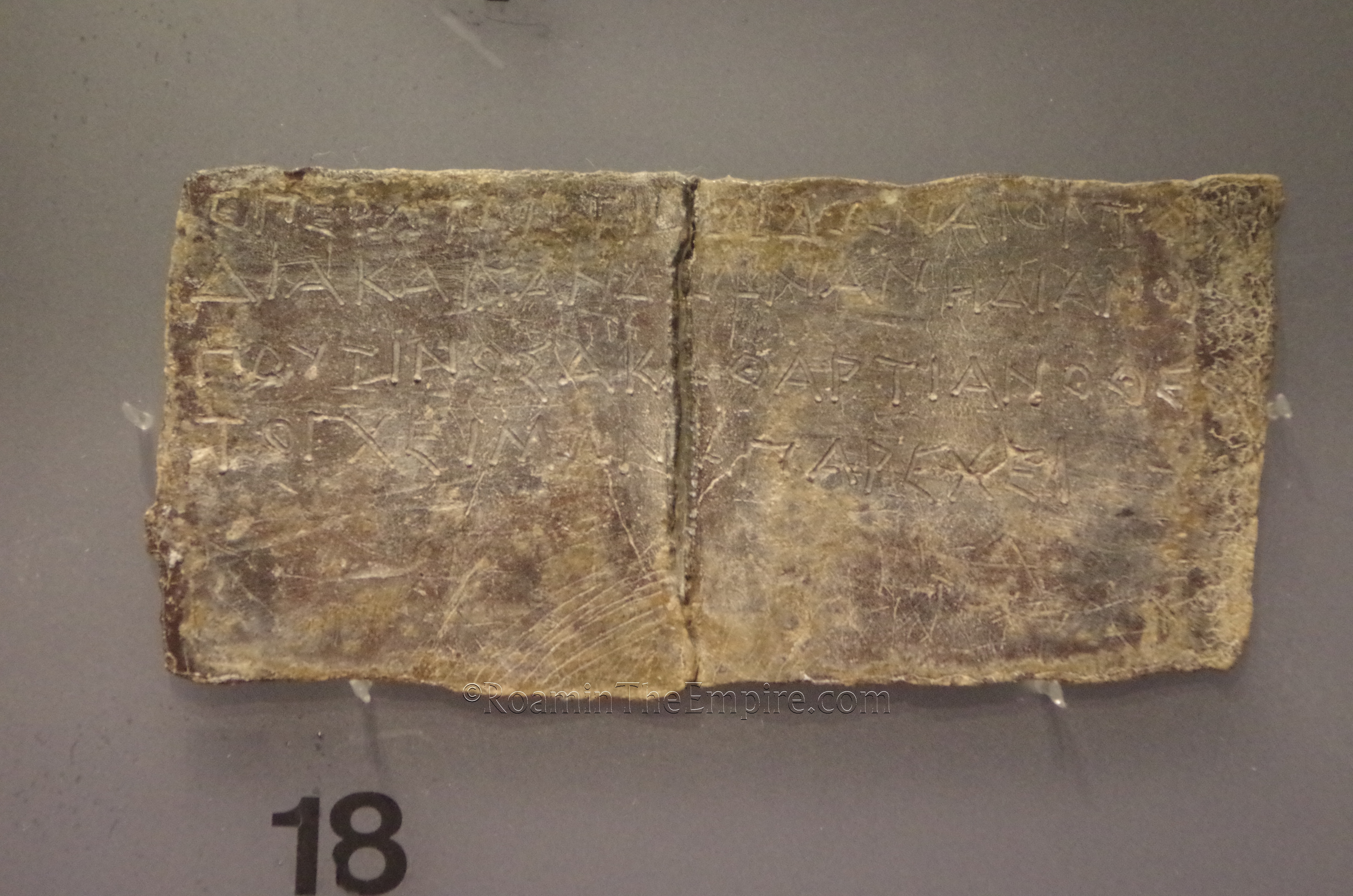 Oracular tablet from Dodona dating to the 3rd to 4th century BCE. On it, the inhabitants of Dodona ask Zeus and Dione if the harsh winter is the result of someone's transgression against the gods. Archaeological Museum of Ioannina.